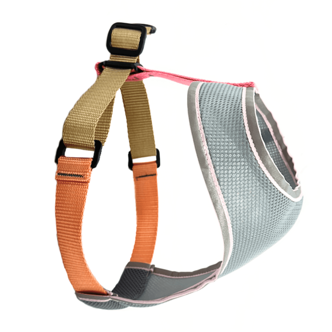 Dog harness with pink and tan straps and a grey body on a white background