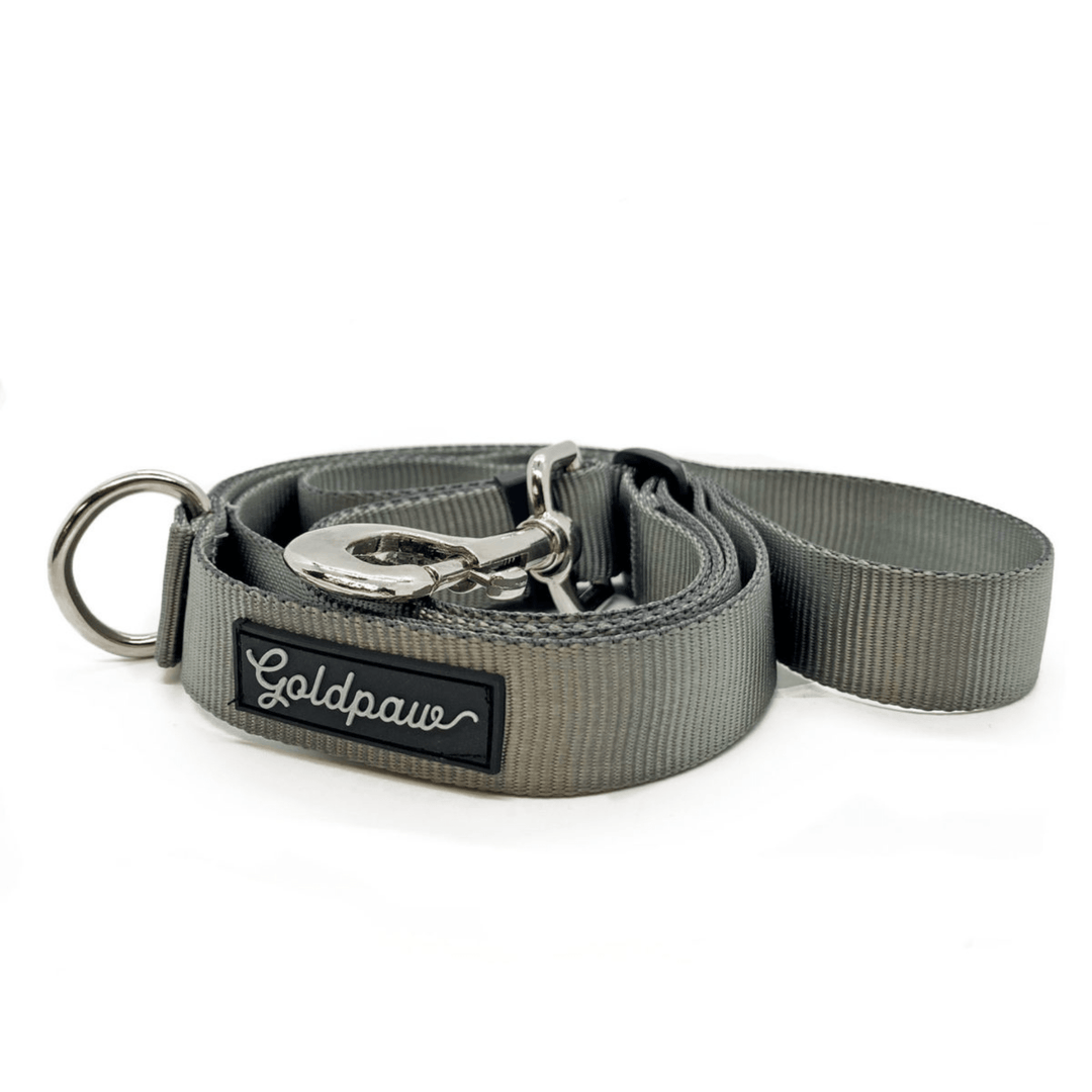 A charcoal grey adjustable leash in front of a white background