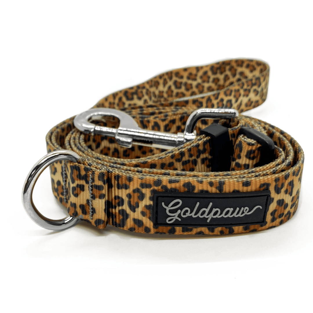 A leopard adjustable leash in front of a white background