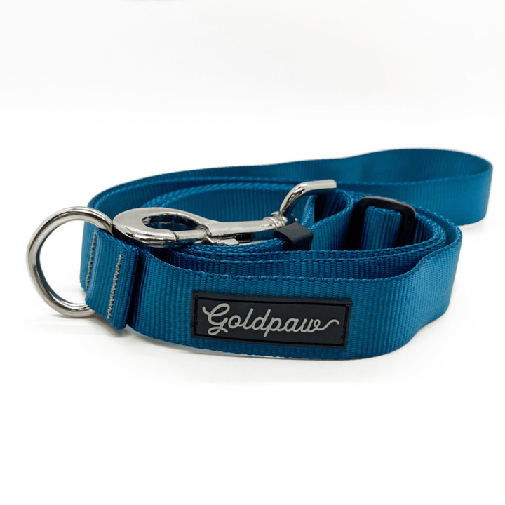 A marine blue adjustable leash in front of a white background