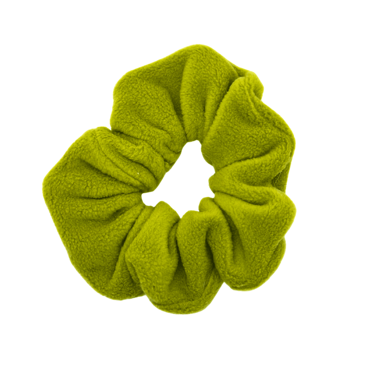 An Avocado green scrunchie in front of a white background