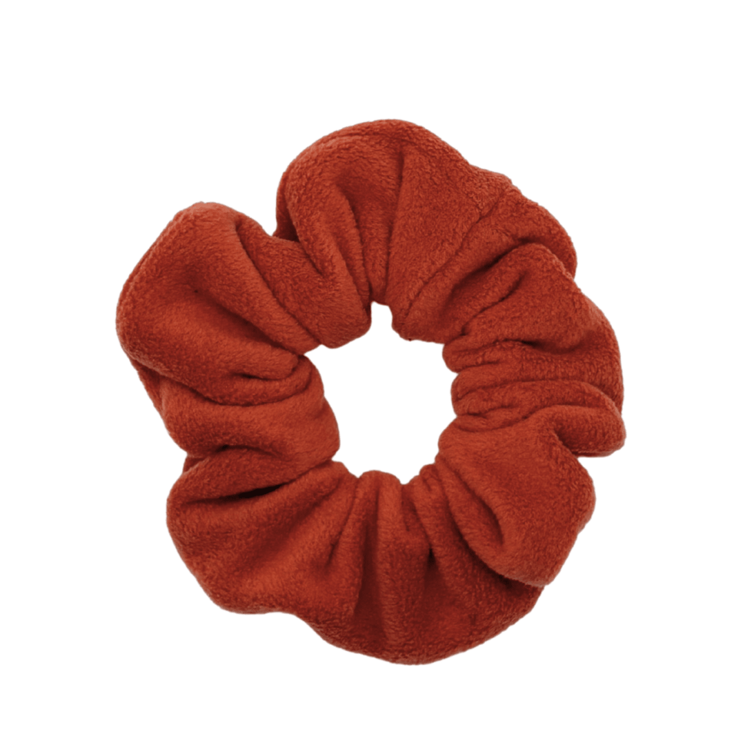 Paprika orange scrunchie on a white background