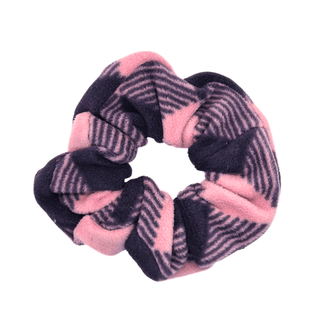 A rose pink and huckleberry purple buffalo check scrunchie in front of a white background
